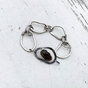 Zilveren schakelarmband met rookkwarts